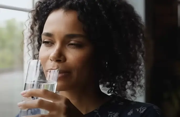 Woman drinking glass of water